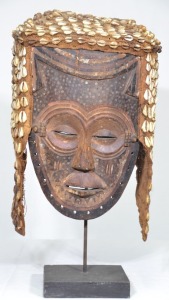 Tribal - Pacific Islands Mask on Stand, wood and fibre decorated with shells, 46 x 25cm