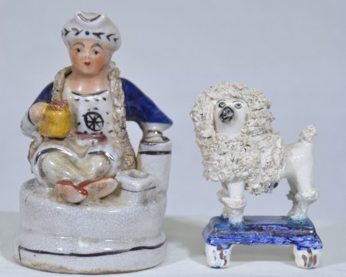 Figurine x2 - Staffordshire figural inkwell merchant / sailor and miniature poodle figurine. Minor restoration to dog.