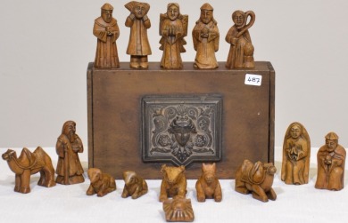 Religious Items - Timber nativity box featuring decorative face containing 15 items.