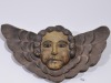 Religious Artifact - Spanish colonial winged angel, Carved timber with painted highlights, D 32cm.