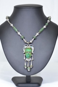 Jewellery - Unmarked silver necklace with tribal face pendant carved into green aventurine