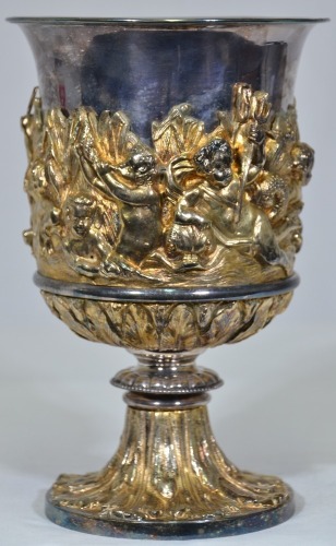 Antiques - Chalice featuring gilt relief with cherubs. Heavy and ornate. 23cm.
