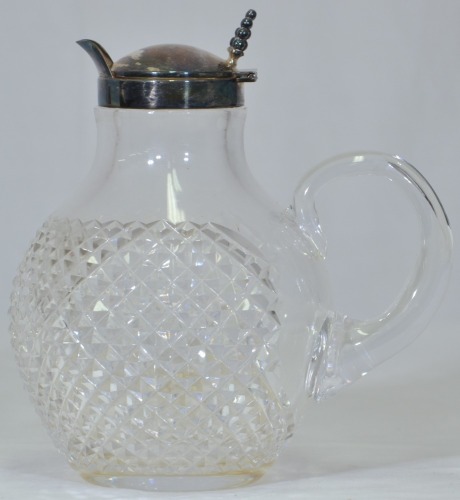Antiques - Cut glass claret jug with a silver fitted lid. 18cm.