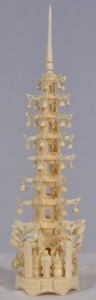 Asian Artifact - Carved Figure. Intricate carved non-composite temple featuring arms with moving bells. H 23cm. Minor damage. Very impressive carving.