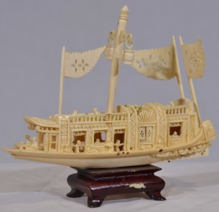 Asian Artifact - Carved Figure. Intricate non-composite carving of a junk H 15cm x W 16cm. Some staining.