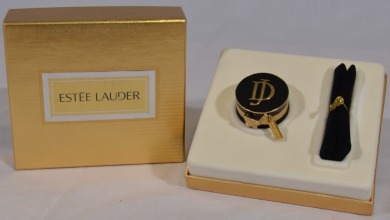 Compacts - Perfume Holder. Estee Lauder made solid perfume compact made exclusively for David Jones, "DJ" initials to the front with gift bag presented in a hat box.