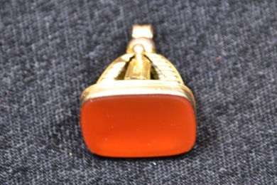 Jewellery -Synthetic stone in gold fob - Stamped 9kt gold. Weighs 9.5g
