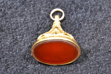 Jewellery -Unknown stone in gold fob - Tested 17kt gold. Weighs 13.3g
