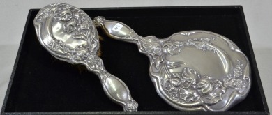 Silver Dressing table items - Brush and Mirror set. Hallmarked silver. B.J.K & Co.
