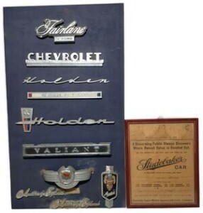 Wall Art x 2 - Mounted Assorted Car Badges & Studebaker Framed Clipping